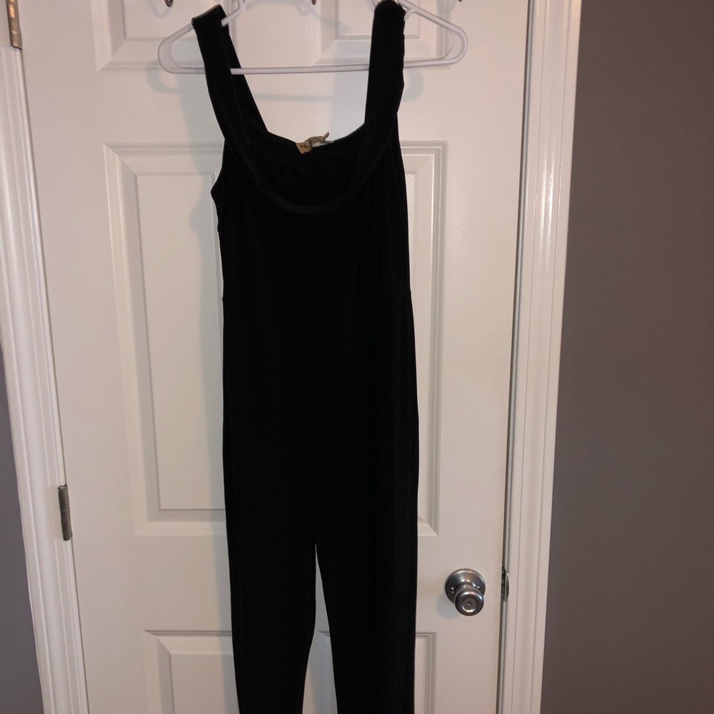 Black romper with ruffle neck